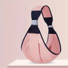 A pink soft cotton baby ring sling carrier with black accents displayed on a white surface.
