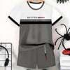 A white t-shirt and matching gray shorts set featuring the word Boston on the shirt.