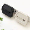 A black and white retractable ceramic blade cutter with a magnetic lock shown on a white surface.
