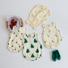 A set of cream-colored baby cotton sleeveless bodysuits with small orange and green leaf patterns.