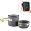 A set of dark gray camping cookware, including a pot and a bowl, with a black mesh bag for storage.