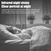 A person sleeping peacefully under a blanket, with an infrared night vision camera visible nearby.