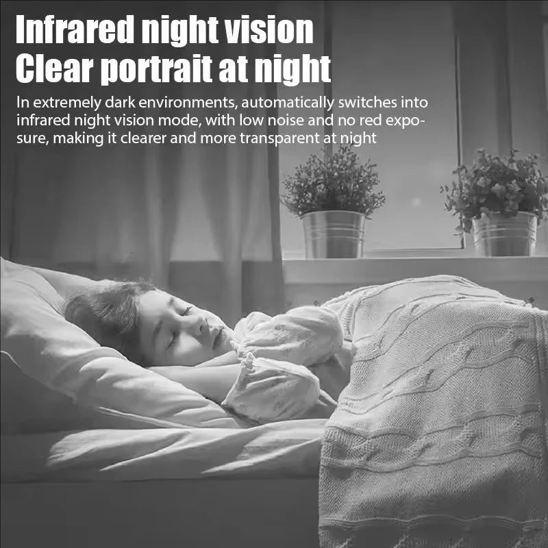 A person sleeping peacefully under a blanket, with an infrared night vision camera visible nearby.