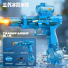 A transparent blue automatic electric water gun with a barrel and grip is shown firing water in a splash.
