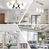 A modern kitchen interior featuring pendant lights and a large window with natural light.
