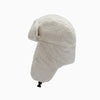 A light beige classic Russian Ushanka trapper hat with a thick fur lining.