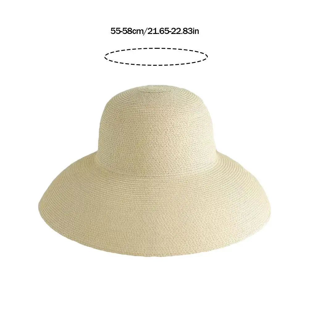 A beige wide brim straw sun hat shown with a measurement line indicating its size.