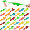 A set of colorful dinosaur finger catapult toys shown in various colors and shapes.