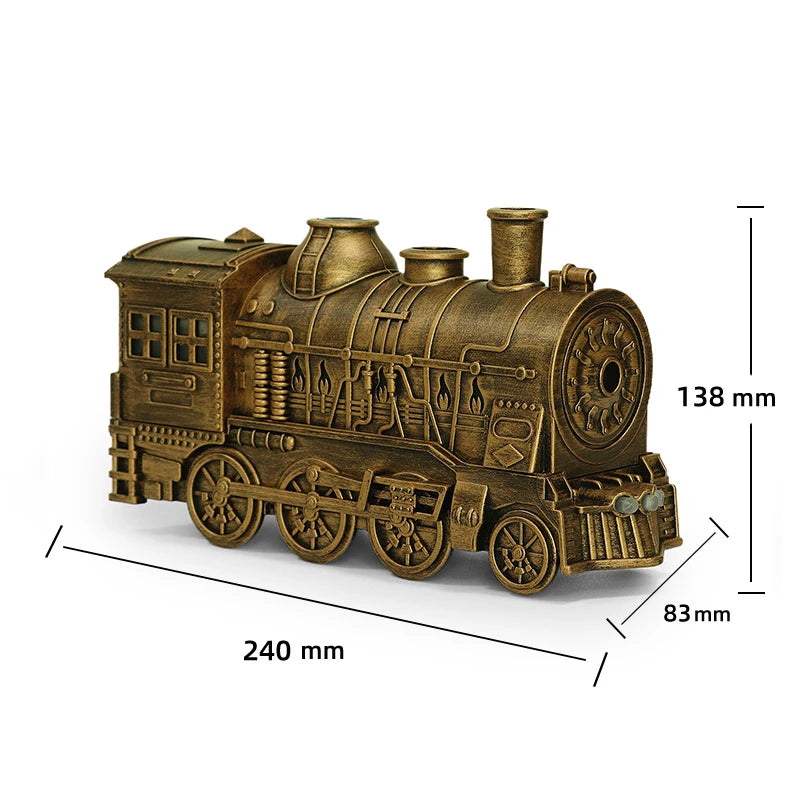 Modelo de locomotora antigua color latón usado como difusor de aromaterapia con efecto de anillos de humo.