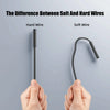 Hands hold a comparison between a hard wire and a soft wire to illustrate the difference.