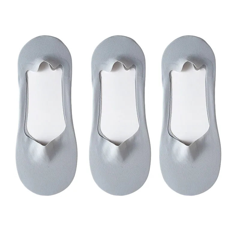 Three pairs of gray silicone grip no-show socks shown from the sole view.