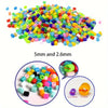 A pile of colorful plastic fuse beads in various sizes, including 5mm and 2.6mm, shown with close-ups of bead lengths.