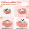 A set of pink plush donut pet beds for dogs and cats in various sizes, demonstrating stretching space.