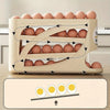 Beige rullende 3-lags eggorganiserer med ulike eggformer og diagram for plassering.