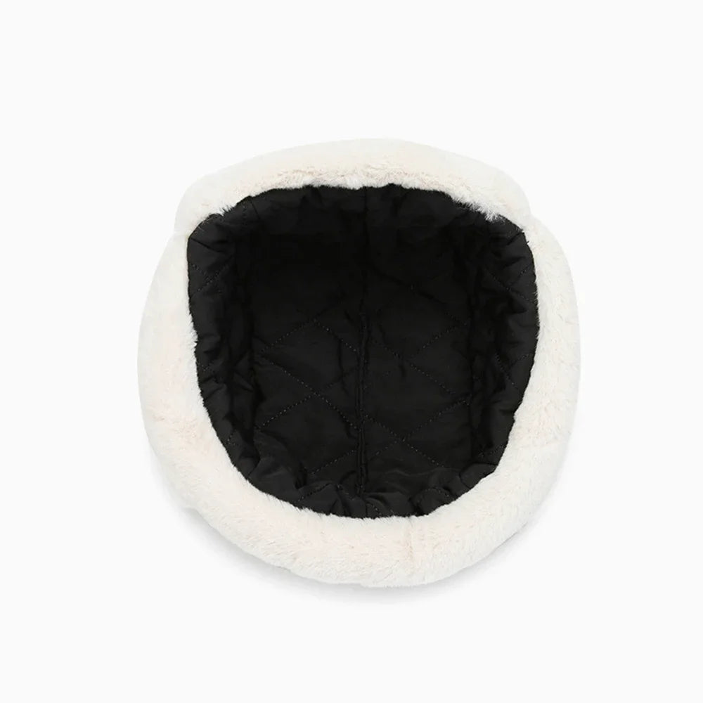 A classic Russian ushanka trapper hat with a white fur lining and black interior.
