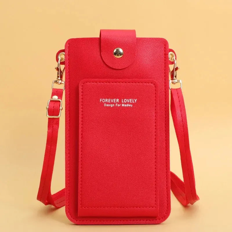 A red soft leather crossbody handbag with a flap and a touch screen pocket.