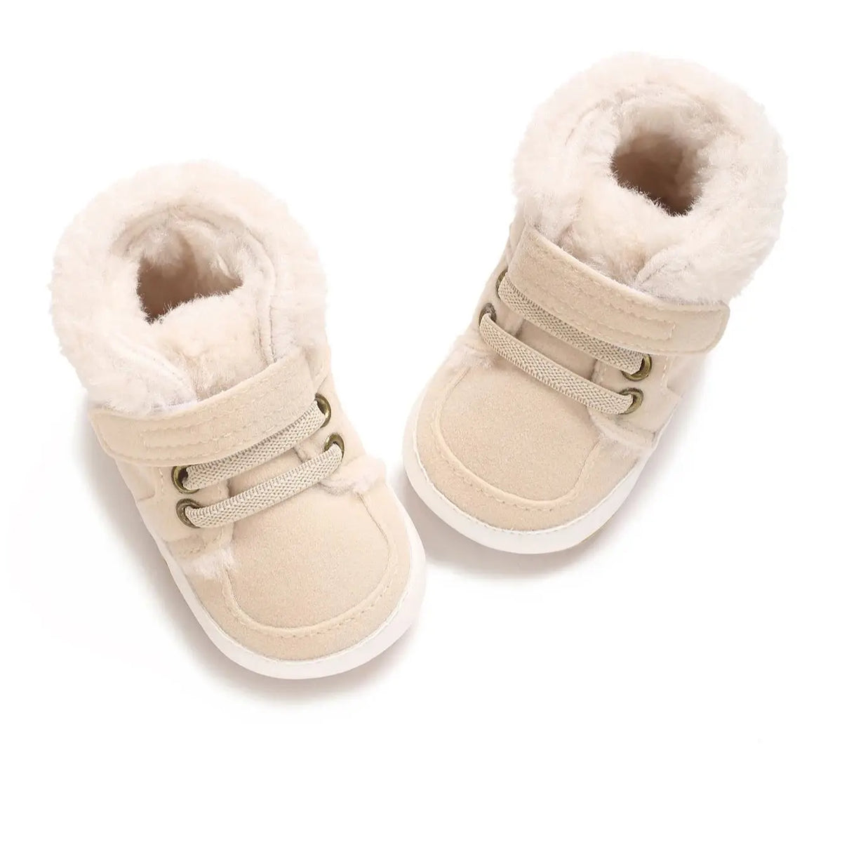 A pair of beige faux fur baby winter snow boots for toddlers.