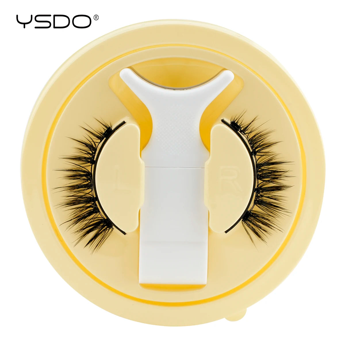 Un set de faux cils magnétiques 3D jaunes avec une pince blanche sur fond circulaire.