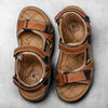 Pair of brown men's genuine leather air cushion sandals with black accents