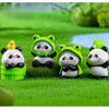 A set of cute green resin panda figurines in various poses placed on a bright green lawn.