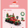A 6-in-1 building block set featuring a red and green vehicle, a snow house, Santa, and deer figures.