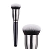 A pair of professional makeup brushes with silver handles and fluffy black bristles.