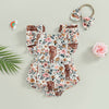 A floral cow print baby romper with a matching headband is displayed on a light background.