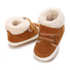 A pair of tan suede baby winter snow boots with fluffy cream-colored faux fur lining and white soles.