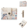 A light pink floral print women's wallet with a zipper closure and card slots, featuring a character illustration.