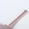 A pink portable silicone pacifier storage case with a lanyard, shown in profile.