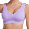 A purple breathable plus size sports bra with padded support shown on a model's chest.