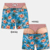 Men's swim trunks featuring a patriotic American flag print with pink and orange flowers on a blue tropical background
