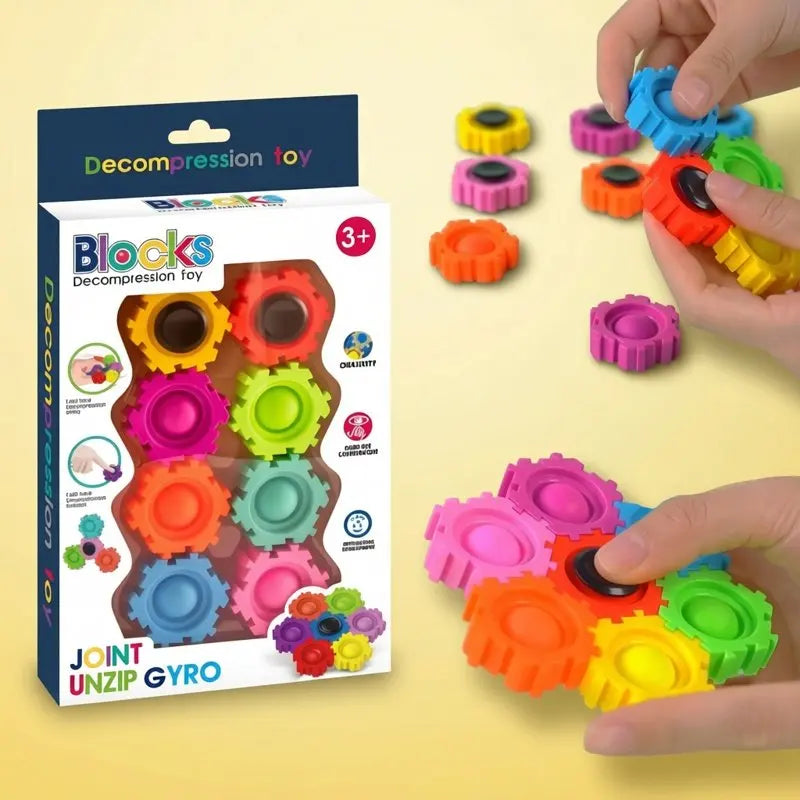 A set of colorful decompression toy blocks and fidget spinners being held by a hand.