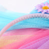 Pink and blue mesh fabric with a pink headband and a purple flower accessory