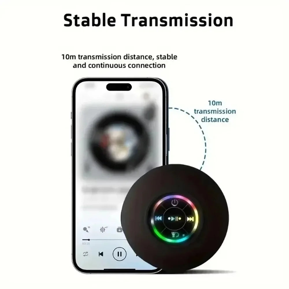 A compact waterproof Bluetooth speaker with a suction cup mount is shown next to a smartphone demonstrating a stable transmis