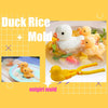 A yellow duck-shaped mold is shown next to a plate of food featuring duck rice molded into the shape of a duck.
