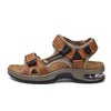 A pair of brown men's genuine leather air cushion sandals with dark accents and a light tan sole.