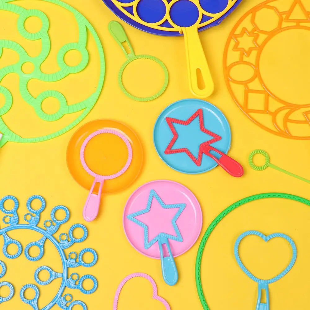 A collection of colorful bubble wands and rings on a yellow background for outdoor play.