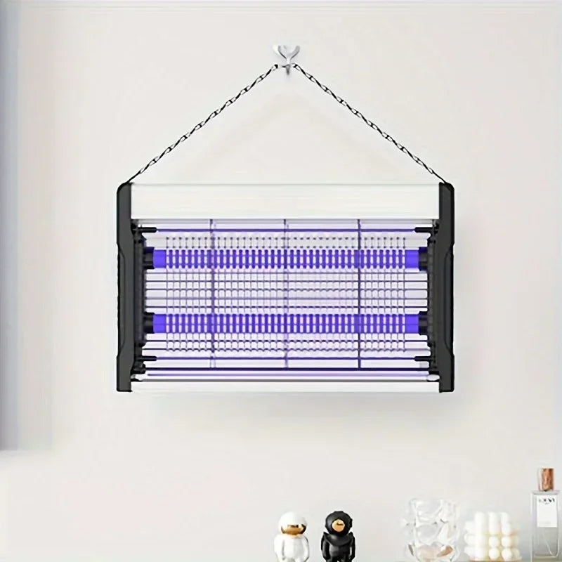 A black electric mosquito killer lamp with a UV light trap suspended by a wire against a white wall.