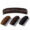 A bundle of dark brown hair is shown with an invisible root lifter comb for voluminous styling.