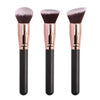 Three professional makeup brushes with pink bristles and gold ferrules shown vertically