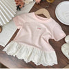 Pink girls cotton short sleeve tee with white lace hem and a small embroidered tag