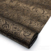 Roll of vintage floral textured faux leather fabric with intricate damask pattern