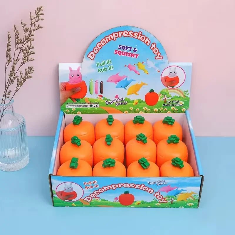Caja de juguete suave y esponjoso para aliviar el estrés, con formas de zanahoria naranja.