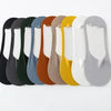 A row of ten men's no-show socks with silicone grip in various colors, including black, green, brown, and yellow.