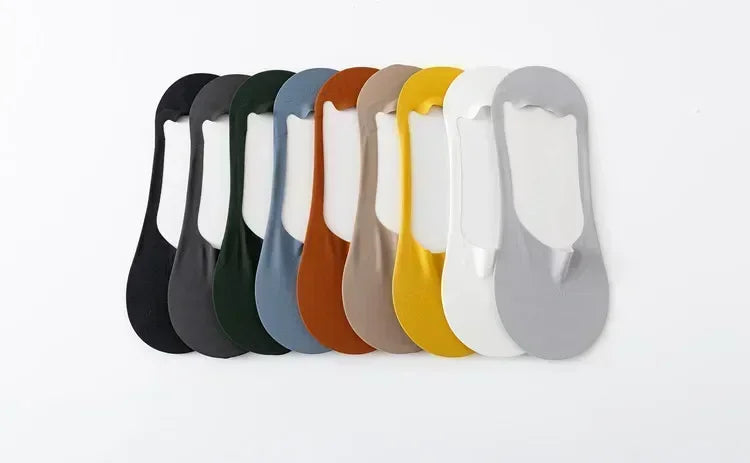 A row of ten men's no-show socks with silicone grip in various colors, including black, green, brown, and yellow.