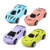 A set of four brightly colored, stylized toy cars in blue, pink, purple, and yellow for a DIY electronic circuit building blo