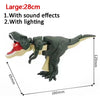 Jouet dinosaure gris foncé à recul, bouche rouge, avec effets sonores et lumineux.