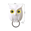 Crochet magnétique à clés hibou blanc avec grands yeux jaunes et anneau métallique.