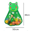Green frog-shaped suction cup toy storage bag filled with various small toys